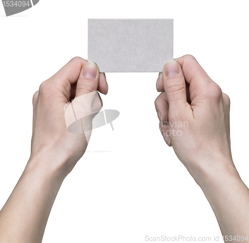 Image of hands holding a business card