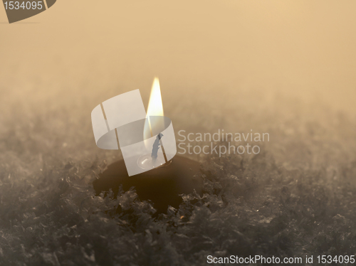 Image of candle and snow