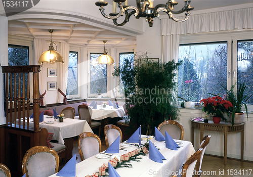 Image of interieur with feastful dinner tables