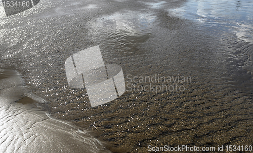 Image of twinkling ebb tide