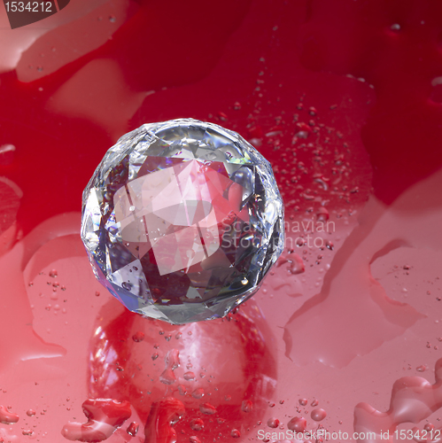 Image of diamond sphere in red wet ambiance