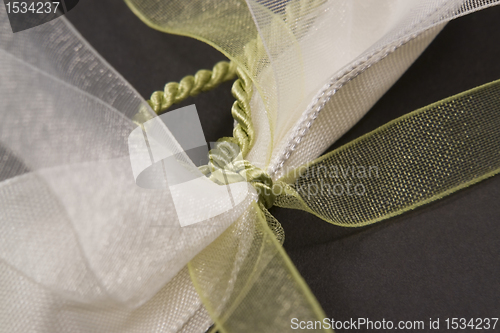 Image of decorative white and green bow