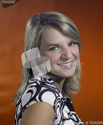 Image of friendly young girl portrait in brown back