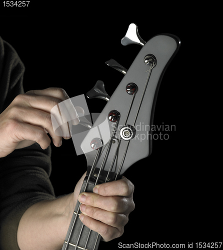 Image of bass guitar tuning