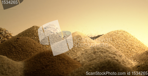 Image of sand piles in warm ambiance