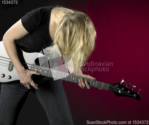 Image of playing bass guitar