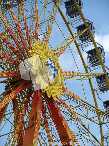 Image of detail of a colorful big wheel