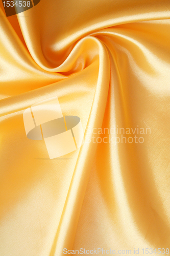 Image of Smooth elegant golden satin as background 