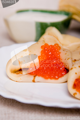 Image of pancake with red caviar