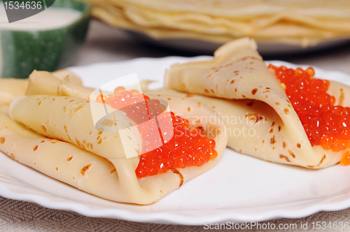 Image of pancake with red caviar