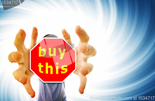 Image of Man grabing a red sign.