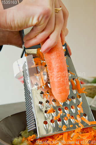 Image of chef grating carrot