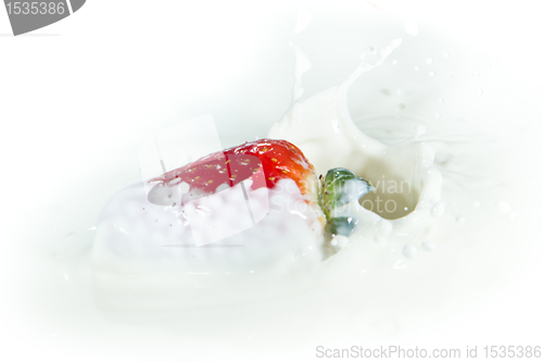 Image of strawberry splashing into milk