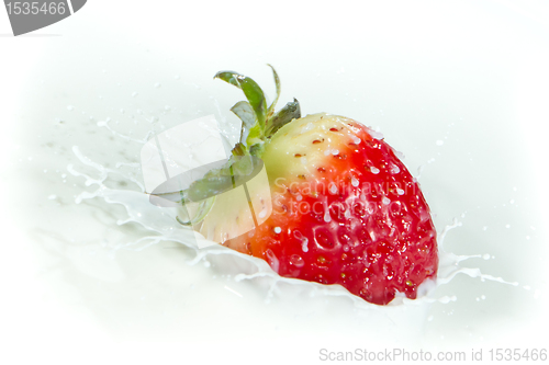 Image of strawberry splashing into milk