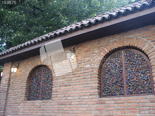 Image of house with mosaic windows