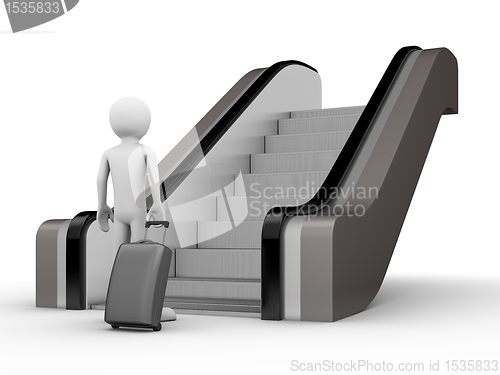 Image of Traveler with a trunk before escalator