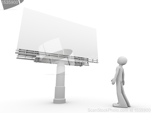 Image of man stands near copyspaced bigboard looking at it