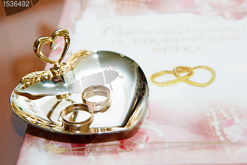 Image of wedding rings and marriage certificate