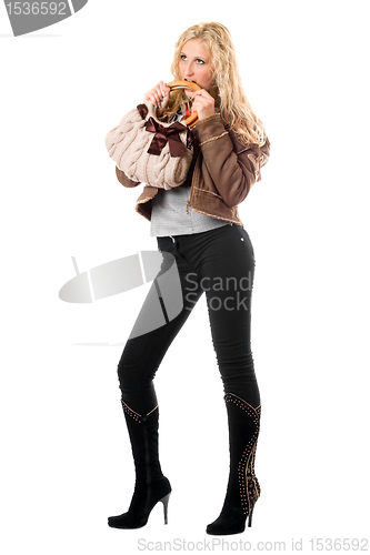 Image of Pretty playful young blonde with a handbag. Isolated