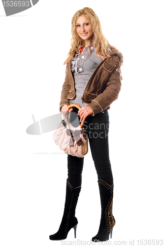 Image of Beautiful young blonde with a handbag. Isolated