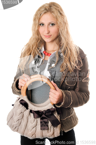 Image of Portrait of attractive young blonde with a handbag
