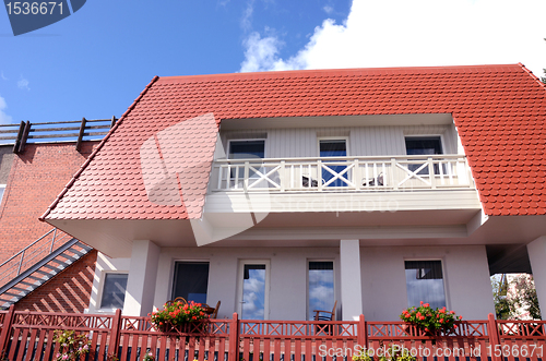 Image of Private residential home balcony windows flowers 