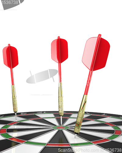 Image of Three darts stuck in a board, top view