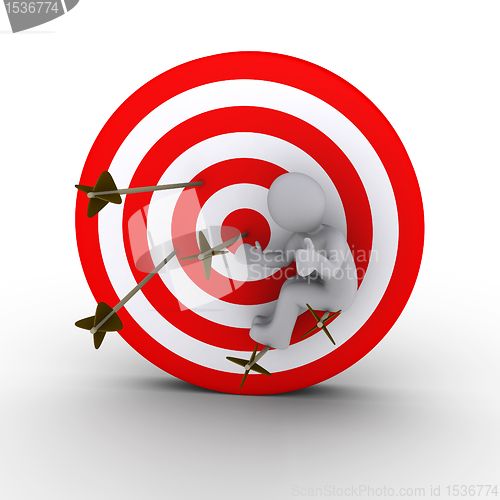 Image of Person sitting on arrows shot at a target