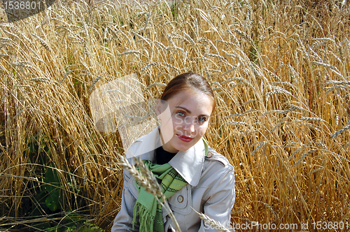 Image of woman in the ears. autumn