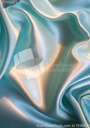 Image of Smooth elegant blue silk as background