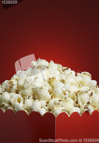 Image of Box of popcorn and red background