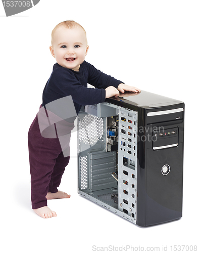 Image of young child with open computer