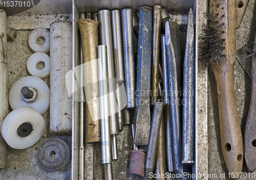 Image of tools in drawer - chisel, punch, steel brush