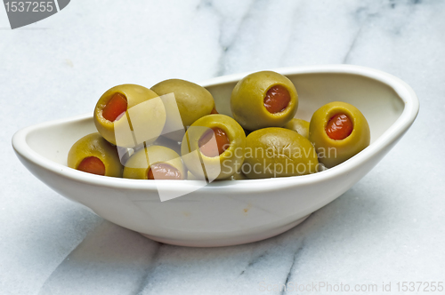 Image of olives filled with red paste