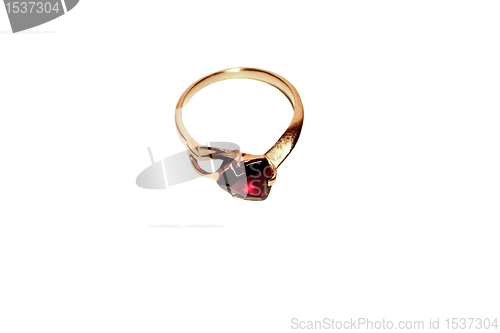 Image of Gold ring with red stone. Isolate