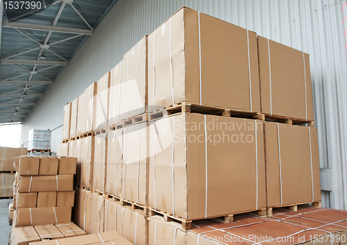 Image of warehouse cardboard boxes arrangement outdoors