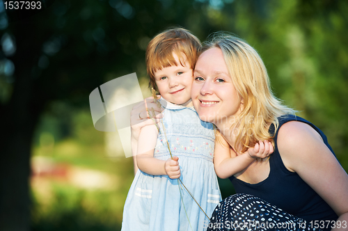 Image of mother and child outdoors