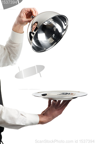 Image of hands of waiter with cloche lid cover