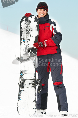 Image of Happy woman with snowboard