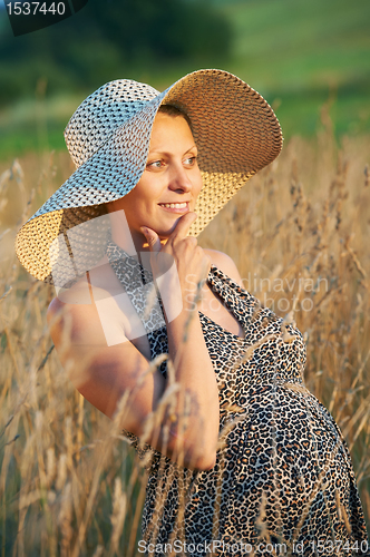 Image of Pregnant woman in field