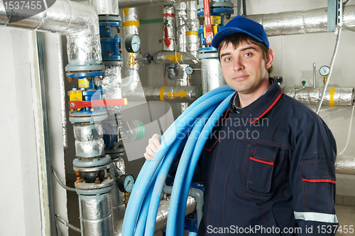 Image of heating engineer repairman in boiler room