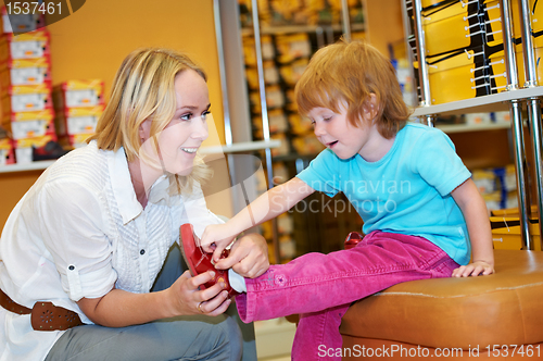 Image of woman and boy making shopping