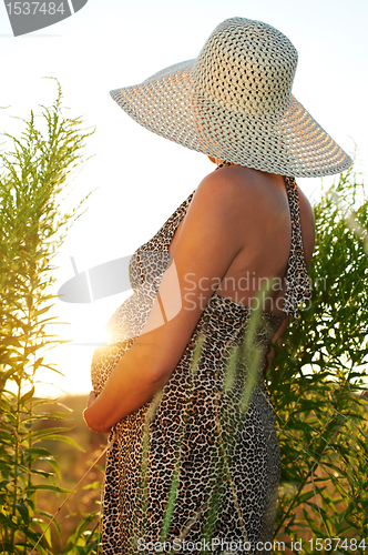 Image of Pregnant woman in field
