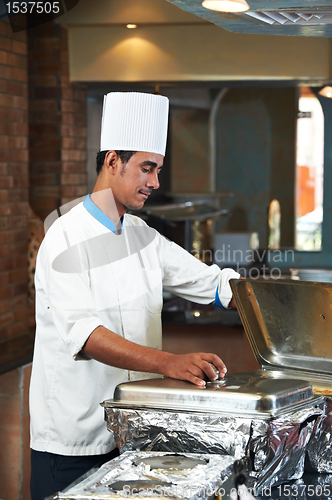 Image of chef boiling a soup