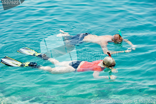 Image of active couple snorkeling at red sea