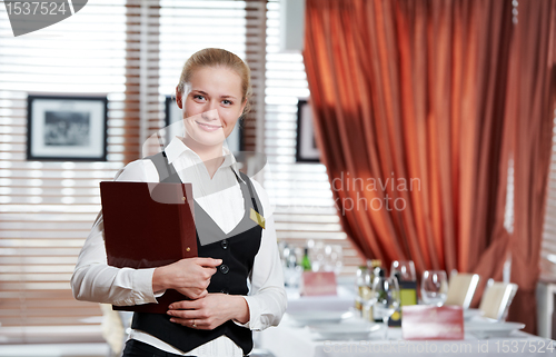 Image of restaurant manager woman at work place