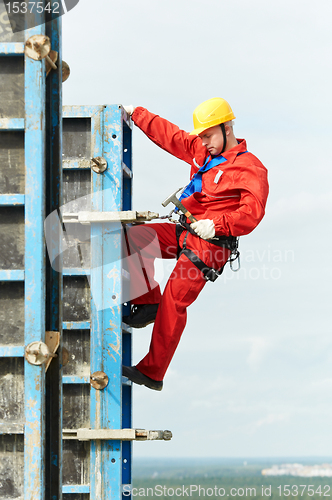 Image of worker mounter at construction site