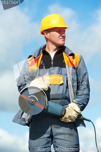 Image of portrait of construction worker with grinder