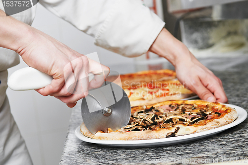 Image of Pizza preparartion - cutting