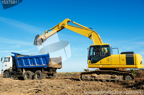 Image of excavator loader at work